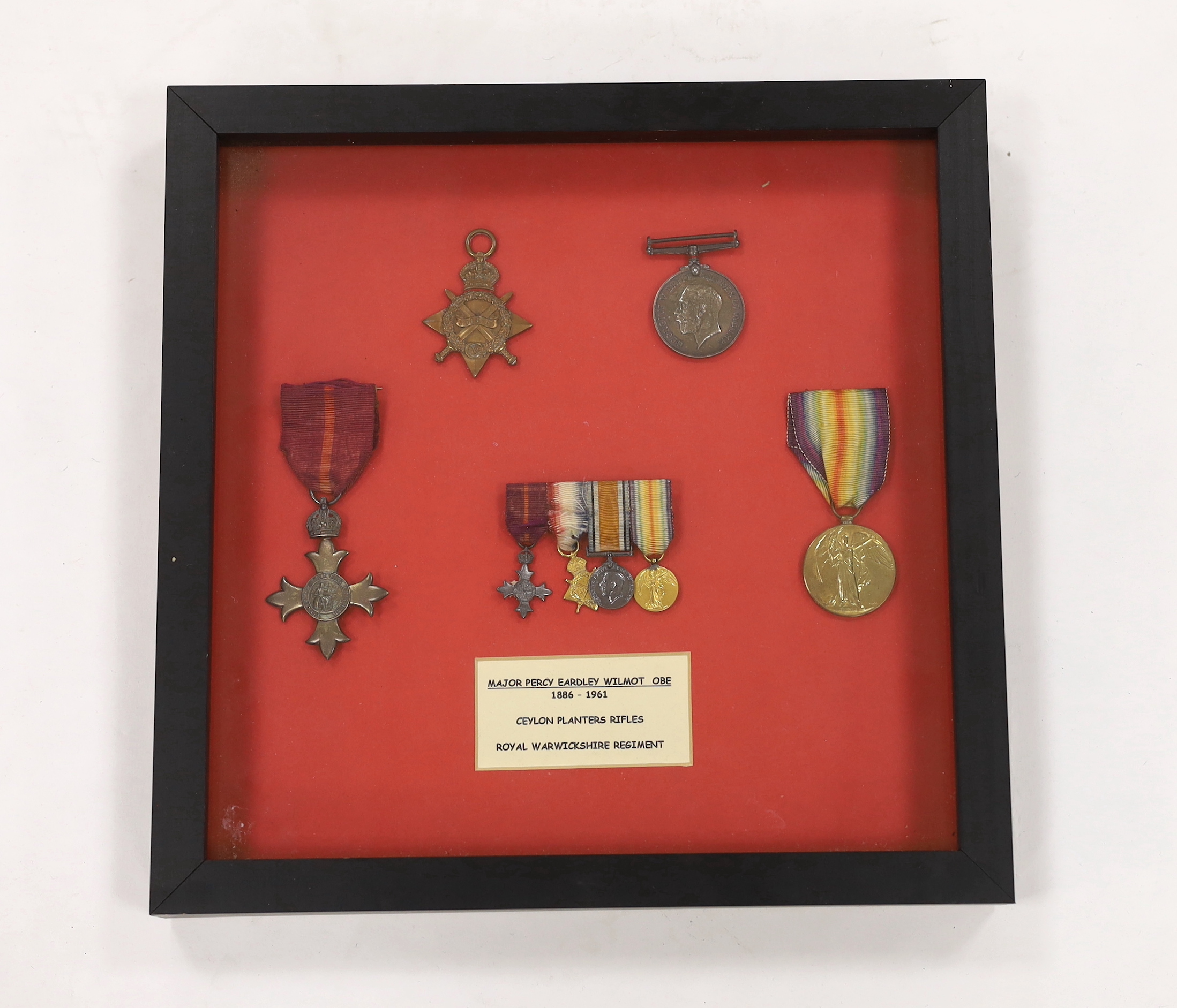 Major Percy Eardley Wilmot, a framed WWI medal group comprising of the War Medal, Victory Medal, 1914/15 Star and military OBE, together with the miniature set